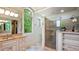 Bright bathroom featuring granite countertops, tiled shower with glass doors, and a large window at 603 Hawks Ridge Ct, Apex, NC 27539