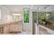 Bright bathroom with double vanity, a glass shower and large mirror at 603 Hawks Ridge Ct, Apex, NC 27539