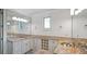 Bathroom with granite countertops, ample cabinet space, and a large mirror with vanity lighting at 603 Hawks Ridge Ct, Apex, NC 27539