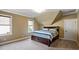 Carpeted bedroom with neutral walls, large window and stylish queen bed at 603 Hawks Ridge Ct, Apex, NC 27539