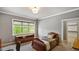 Cozy bedroom with a window view, comfortable bed, and stylish decor at 603 Hawks Ridge Ct, Apex, NC 27539