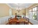 Beautiful dining room with a chandelier and neutral-colored walls at 603 Hawks Ridge Ct, Apex, NC 27539
