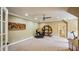 Large game room or flex space with neutral carpet, gaming equipment, and interior decorating at 603 Hawks Ridge Ct, Apex, NC 27539