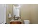 Half bathroom with a unique vessel sink, granite countertop, and a decorative mirror at 603 Hawks Ridge Ct, Apex, NC 27539