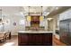 Elegant kitchen features granite countertops, stainless steel appliances, and custom cabinetry at 603 Hawks Ridge Ct, Apex, NC 27539