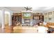 Comfortable living room showcasing a stone fireplace and hardwood floors at 603 Hawks Ridge Ct, Apex, NC 27539