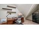 Office with a large desk and shelves on an angled wall at 603 Hawks Ridge Ct, Apex, NC 27539