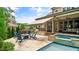 Relaxing outdoor space with built-in kitchen, fireplace, pool and covered patio at 603 Hawks Ridge Ct, Apex, NC 27539