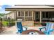 Outdoor kitchen and covered patio with a cozy seating area by the pool at 603 Hawks Ridge Ct, Apex, NC 27539