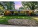 Traditional brick duplex with a shared front porch and a green lawn at 603 Kildaire Farm Road Rd, Cary, NC 27511