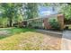 Inviting brick home with a lovely green lawn and mature trees at 603 Kildaire Farm Road Rd, Cary, NC 27511
