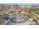Aerial shot of a water fountain surrounded by a landscaped park with outdoor seating areas at 603 Kildaire Farm Road Rd, Cary, NC 27511