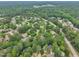 Lush aerial shot of neighborhood with mature trees that gives this property a great balance of privacy and community at 608 Cross Timbers Dr, Durham, NC 27713