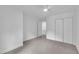 Bright bedroom with neutral carpet and ceiling fan provides a clean and blank canvas for a prospective home buyer at 608 Cross Timbers Dr, Durham, NC 27713