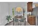 Charming dining room with a bay window, stylish lighting, and contemporary furnishings at 608 Cross Timbers Dr, Durham, NC 27713
