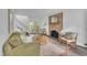 Bright living room featuring a brick fireplace, modern decor, and a seamless transition to the outdoors at 608 Cross Timbers Dr, Durham, NC 27713