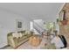 Comfortable living room featuring a brick fireplace, contemporary decor, and staircase to the second floor at 608 Cross Timbers Dr, Durham, NC 27713