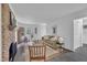 Inviting living room with a brick fireplace, stylish decor, and abundant natural light at 608 Cross Timbers Dr, Durham, NC 27713