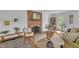 Bright living room featuring a brick fireplace, neutral decor, and ample natural light at 608 Cross Timbers Dr, Durham, NC 27713