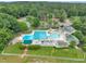 Aerial view of a pool and leisure area complete with lap lanes, lounge chairs, pool and mature shade trees at 608 Cross Timbers Dr, Durham, NC 27713