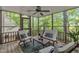 Cozy screened porch with comfortable seating and wooded views provides a tranquil space for relaxation and enjoyment at 608 Cross Timbers Dr, Durham, NC 27713