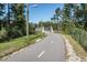 Well-maintained walking path leading to an elevated pedestrian bridge, perfect for leisurely strolls at 608 Cross Timbers Dr, Durham, NC 27713
