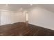 Bright bedroom with hardwood floors, white trim, and ample storage in closet at 612 Dunbar St, Durham, NC 27701