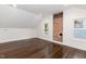Inviting bedroom featuring hardwood floors, natural light, and charming brick detail at 612 Dunbar St, Durham, NC 27701