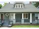 Close-up of home showcasing a welcoming covered front porch and freshly painted exterior at 612 Dunbar St, Durham, NC 27701