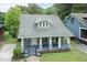 Charming home with a welcoming front porch and well-maintained landscaping at 612 Dunbar St, Durham, NC 27701