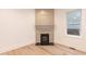 Cozy living room highlighting the fireplace and hardwood flooring at 612 Dunbar St, Durham, NC 27701