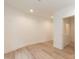 Bright living room with laminate flooring, recessed lighting, and neutral color palette at 612 Dunbar St, Durham, NC 27701