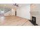 Inviting living area featuring hardwood floors, fireplace, and access to the staircase at 612 Dunbar St, Durham, NC 27701