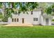 View of the backyard featuring a large wooden deck and a door to the house at 6709 Sunhaven Pl, Raleigh, NC 27615