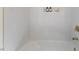 Bright bathroom features white subway tile, bronze fixtures, and a recessed niche for toiletries at 6709 Sunhaven Pl, Raleigh, NC 27615