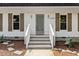 Front entrance with stylish door, sidelights and brick steps at 6709 Sunhaven Pl, Raleigh, NC 27615