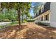 Charming two-story home with black roof, dormers, and a well-manicured lawn at 6709 Sunhaven Pl, Raleigh, NC 27615