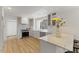 Bright kitchen featuring white cabinets, stone countertops, and stainless steel appliances at 6709 Sunhaven Pl, Raleigh, NC 27615
