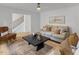 Bright living room featuring a modern design, stylish decor, and comfortable seating arrangements at 6709 Sunhaven Pl, Raleigh, NC 27615