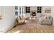 Inviting living room with fireplace, built-in shelving, and natural light from large windows at 6709 Sunhaven Pl, Raleigh, NC 27615