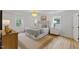 This bedroom features a decorative chandelier, accent rug, and a luxurious bed with a tufted headboard at 6709 Sunhaven Pl, Raleigh, NC 27615