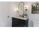 This powder room includes a vessel sink and statement mirror with sconces at 6709 Sunhaven Pl, Raleigh, NC 27615