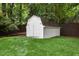 View of a white shed in the backyard of the property with green grass at 6709 Sunhaven Pl, Raleigh, NC 27615