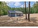 View of the back of the house highlighting the landscaped yard and blue siding at 679 Jasmine Rd, Fuquay Varina, NC 27526