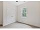 Well-lit bedroom with plush carpet, double door closet, and a window offering natural light at 679 Jasmine Rd, Fuquay Varina, NC 27526