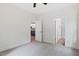 Bedroom view with kitchen and bathroom access, neutral carpet, and white walls at 679 Jasmine Rd, Fuquay Varina, NC 27526