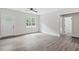 Inviting living room featuring light floors, white walls, bright windows, and a view of the outdoors at 679 Jasmine Rd, Fuquay Varina, NC 27526