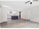 Bright living area featuring stylish flooring, a modern kitchen island, and a ceiling fan at 679 Jasmine Rd, Fuquay Varina, NC 27526