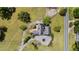 Aerial shot of the property featuring a well maintained lawn and mature landscaping at 70 S Patterson St, Coats, NC 27521