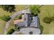 Aerial view displaying the elegant home and gardens surrounded by mature trees and lawn at 70 S Patterson St, Coats, NC 27521